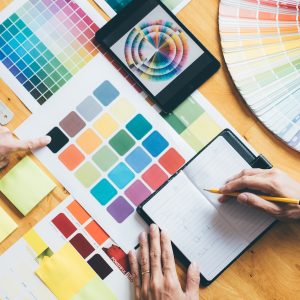 Young creative team having a meeting, Architectural drawing with work tools and accessories Young creative team having a meeting, Architectural drawing with work tools and accessories